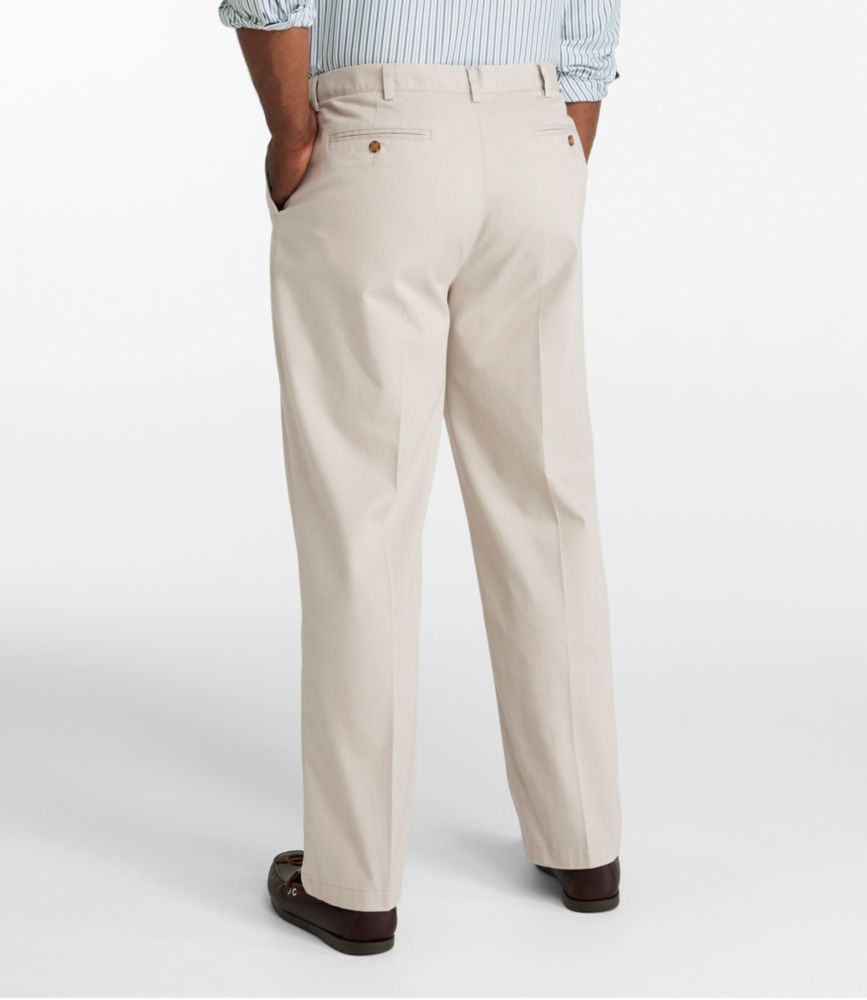 Men’s straight-leg beige chino pants shown from the back, with welt back pockets and belt loops.