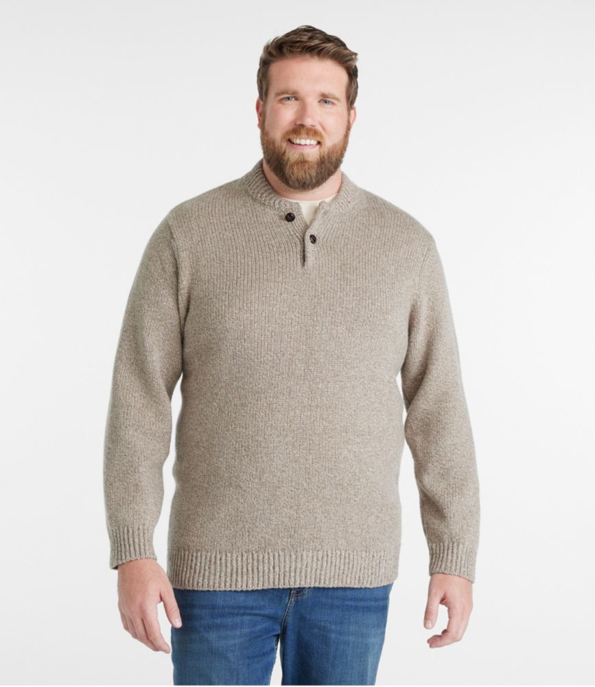 Men’s natural ragg wool Henley sweater with long sleeves and buttoned mock neck, shown worn with jeans.