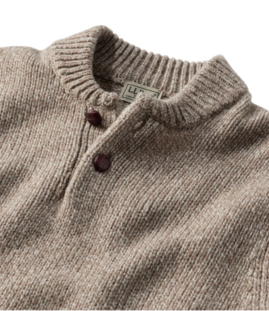 Men's natural ragg wool Henley sweater close-up, showing ribbed collar and two dark brown buttons.