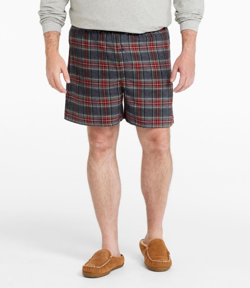 Men’s plaid flannel boxer shorts in gray, red, green, and blue tartan, shown worn from the front.