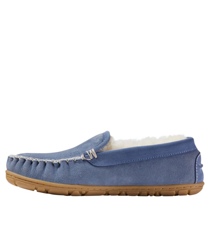 Women’s blue suede Venetian slipper with shearling lining and tan rubber sole, shown in side profile on white background.