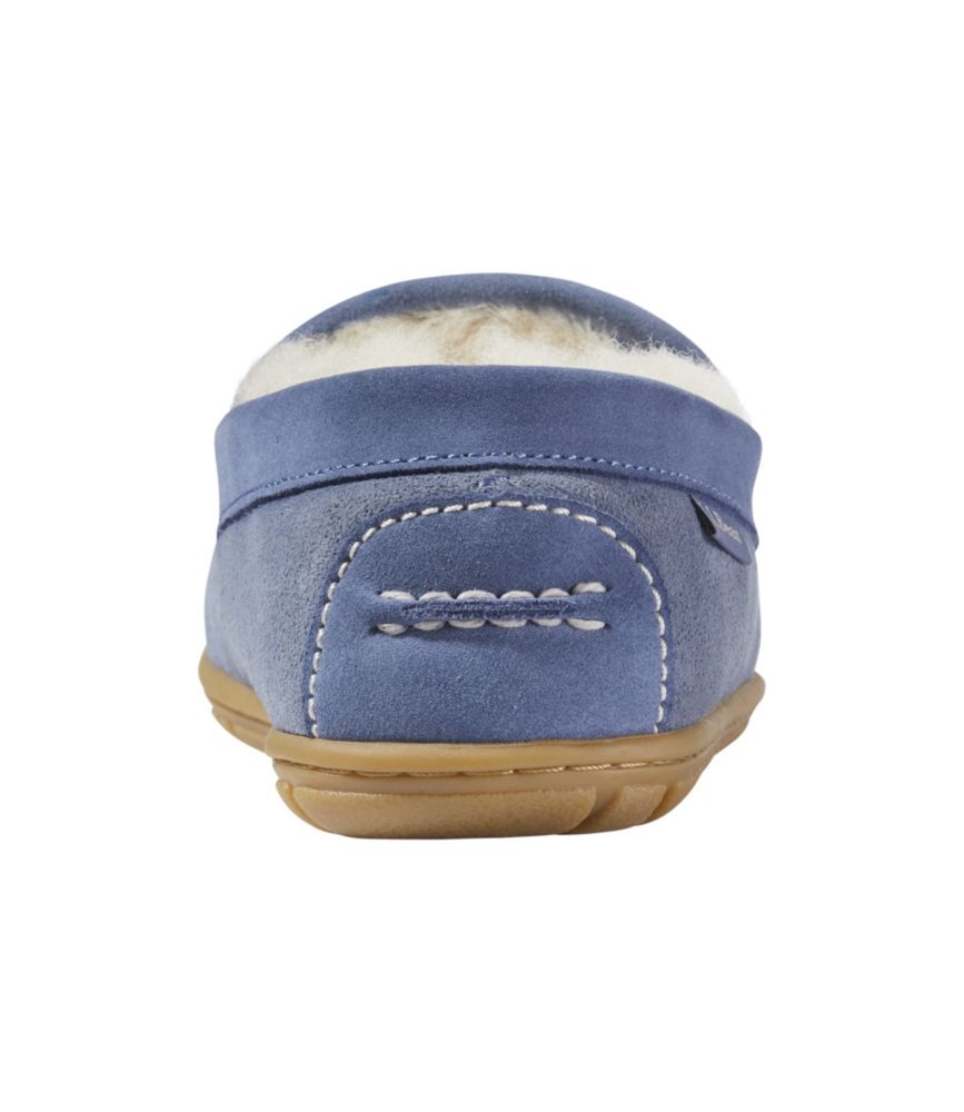 Women’s blue suede Venetian slipper, rear view, with white shearling lining and tan rubber sole.