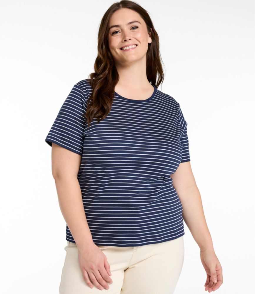 Woman wearing a navy and white striped short-sleeve crewneck cotton tee with a relaxed fit.