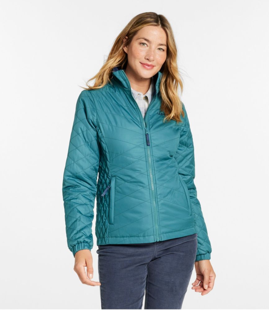 Women’s teal quilted fleece-lined PrimaLoft jacket with stand collar and zip pockets, shown worn from the front.