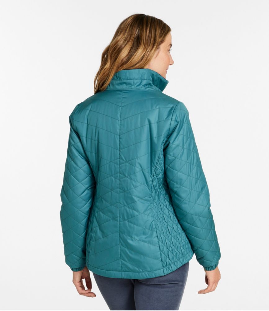 Women's teal quilted PrimaLoft jacket shown from the back, worn by a model with a raised collar.