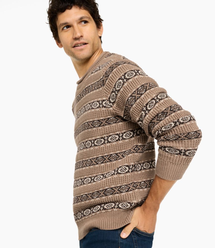 Men's cream waffle crewneck sweater with red and gray Fair Isle pattern, worn with blue jeans.