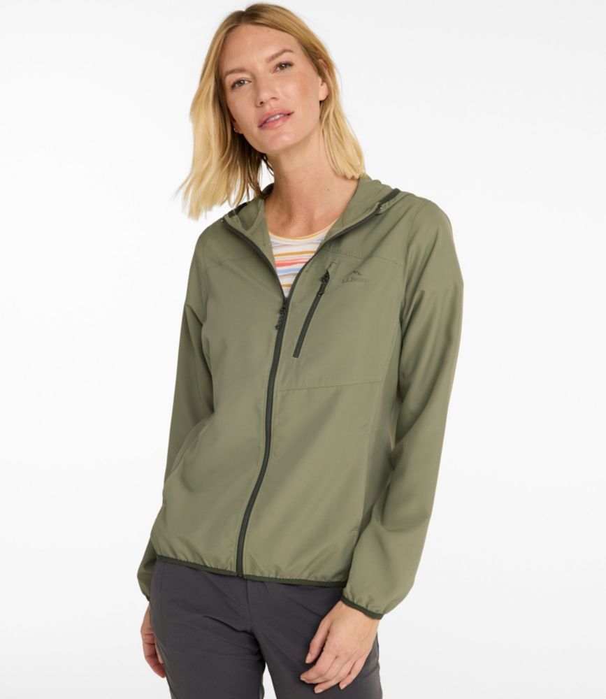 Women’s olive gray lightweight hooded jacket with front zip and chest pocket, shown worn with casual pants.