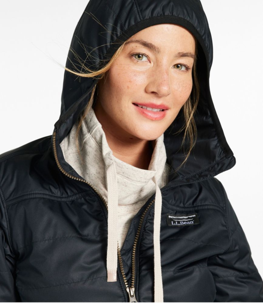 Woman wearing a black L.L.Bean hooded puffer coat over a light heather hoodie, shown from the chest up.