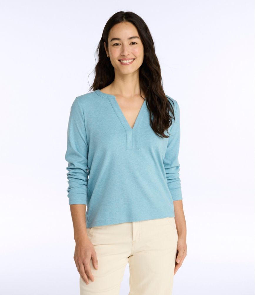 Women’s alpine blue long-sleeve split neck cotton tee worn by a model, shown from the front with sleeves down.